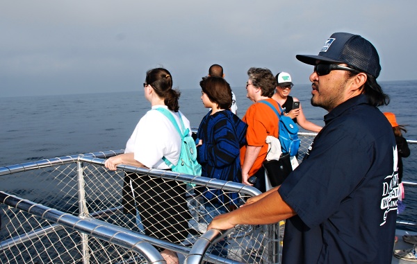 ON THE LOOKOUT -- Eric Yee (right) is on the shark search.